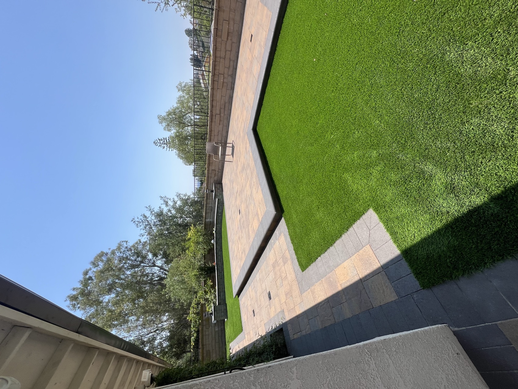 Finished raised patio & wraparound turf
