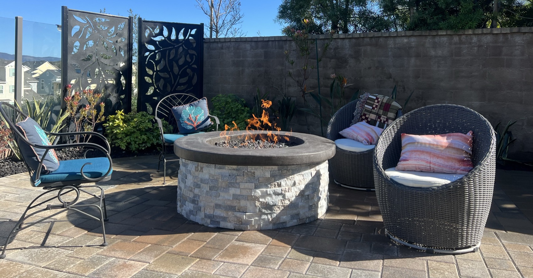 A completed B&M paver patio with fire-pit lounge